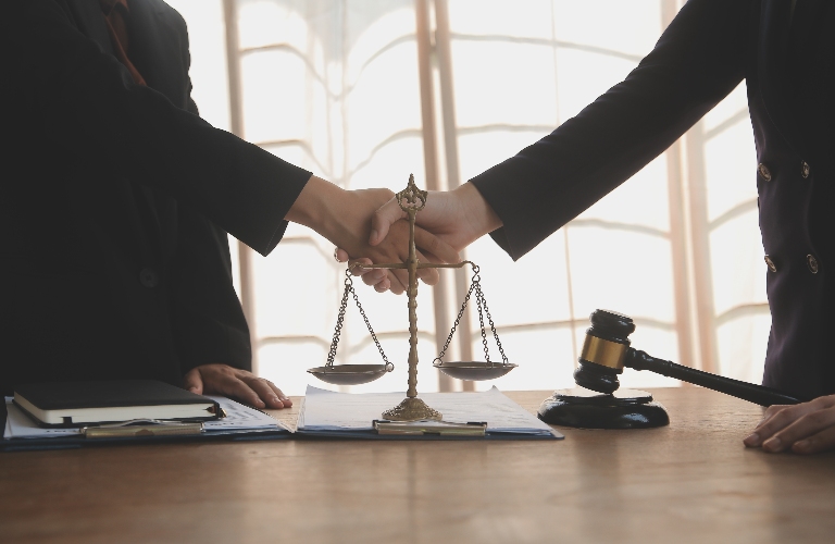Lawyer shaking hands with a client