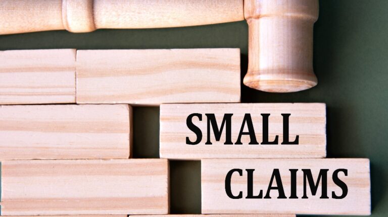 Small Claims words on wooden blocks and judge's gavel