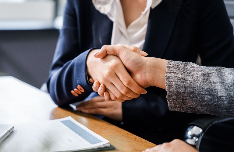 Lawyer and client are shaking hands