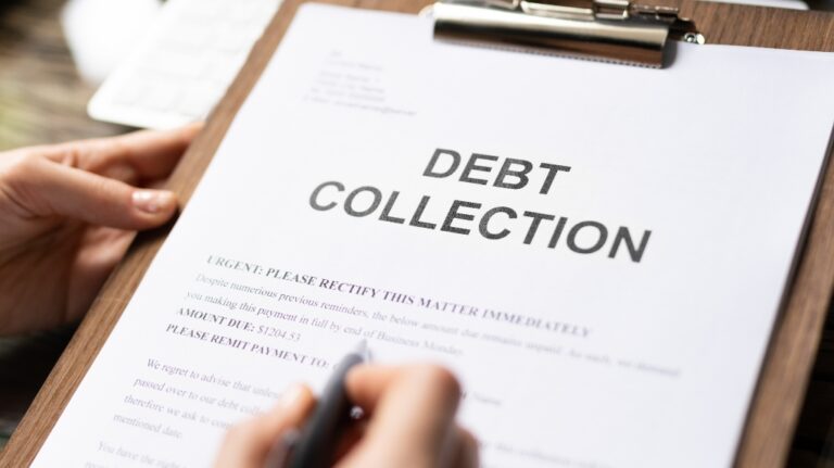 Woman reading debt collection notice letter