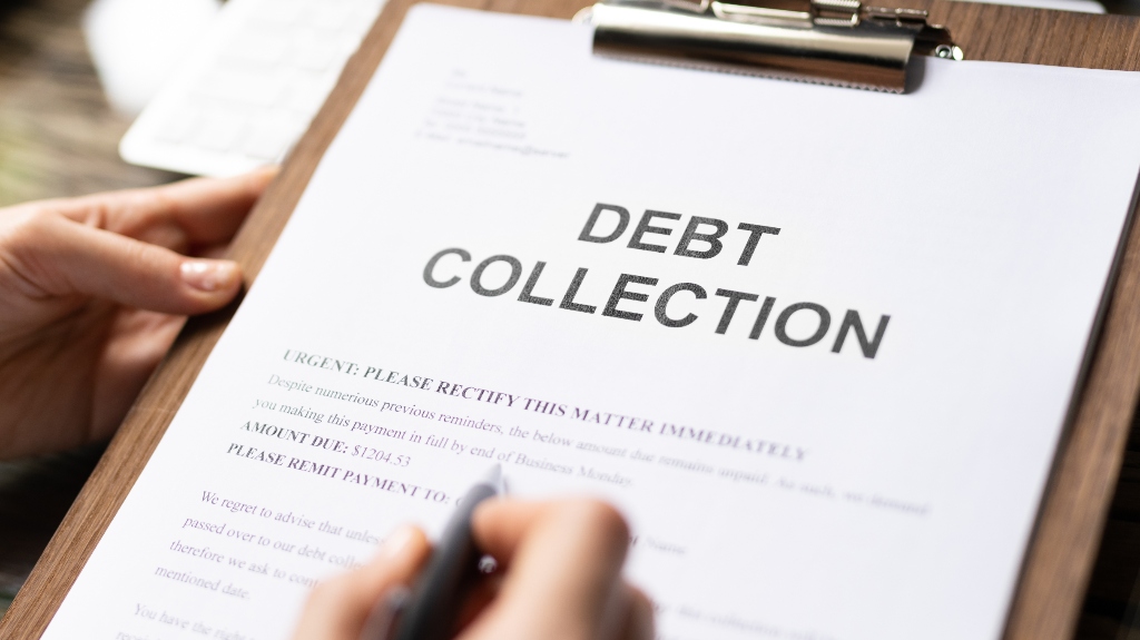 Woman reading debt collection notice letter